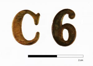 Brass letter "C" and number "6" from Fort Richardson