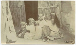 Three_girls_and_a_woman_checking_hair